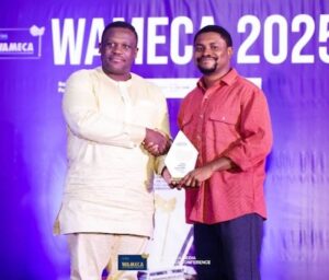 ghana's minister for communications hon. sam george (left) presenting award to mr. kunle adebajo (right) of nigeria who won the ultimate west africa journalist of the year award.